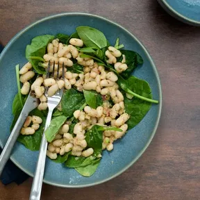 Photo of bean salad with spinach and mustard dressing