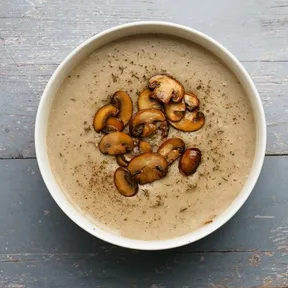 Photo of a bowl vegan Creamy mushroom soup