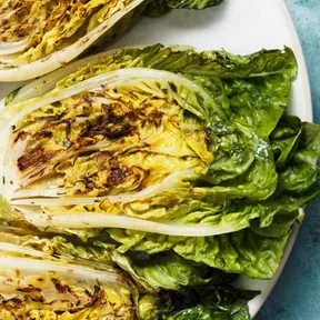 Photo of grilled baby romaine lettuce on a plate