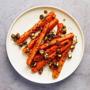 Photo of a plate of grilled carrots with dill and hazelnut from the oven. Can also be prepared on the barbecue.