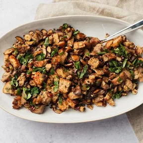 Photo of mixed mushroom stuffing with hazelnuts on a platter