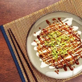 Photo of vegan Okonomiyaki  with pointed cabbage