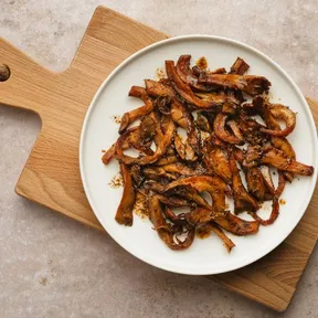 Photo of a plate of oyster mushrooms from oven with a Mexican twist