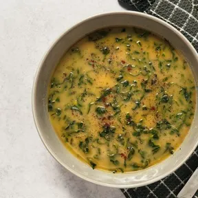 Vegan portuguese cabbage soup with palm cabbage and smoked bell pepper