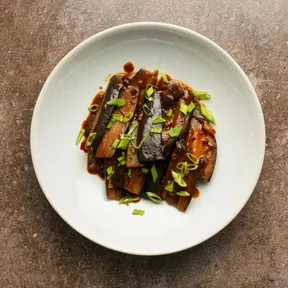 Photo of a plate of sichuan eggplants by Fuchsia Dunlop