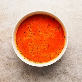 Photo of a bowl of tomato bell pepper soup. A nice easy dish with no fuss.