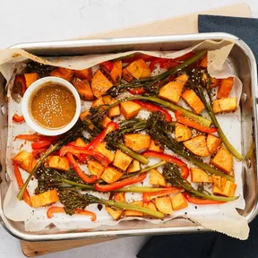 Photo of a Traybake with sweet potatoes and sesame dressing